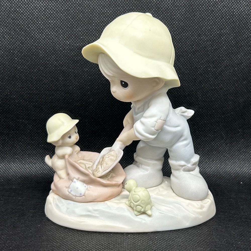 Precious Moments "Nothing Can Dampen The Spirit Of Caring " figurine